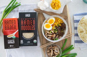 Ocean's Halo ramen broth and noodles with a bowl of prepared ramen, topped with roasted seaweed snacks